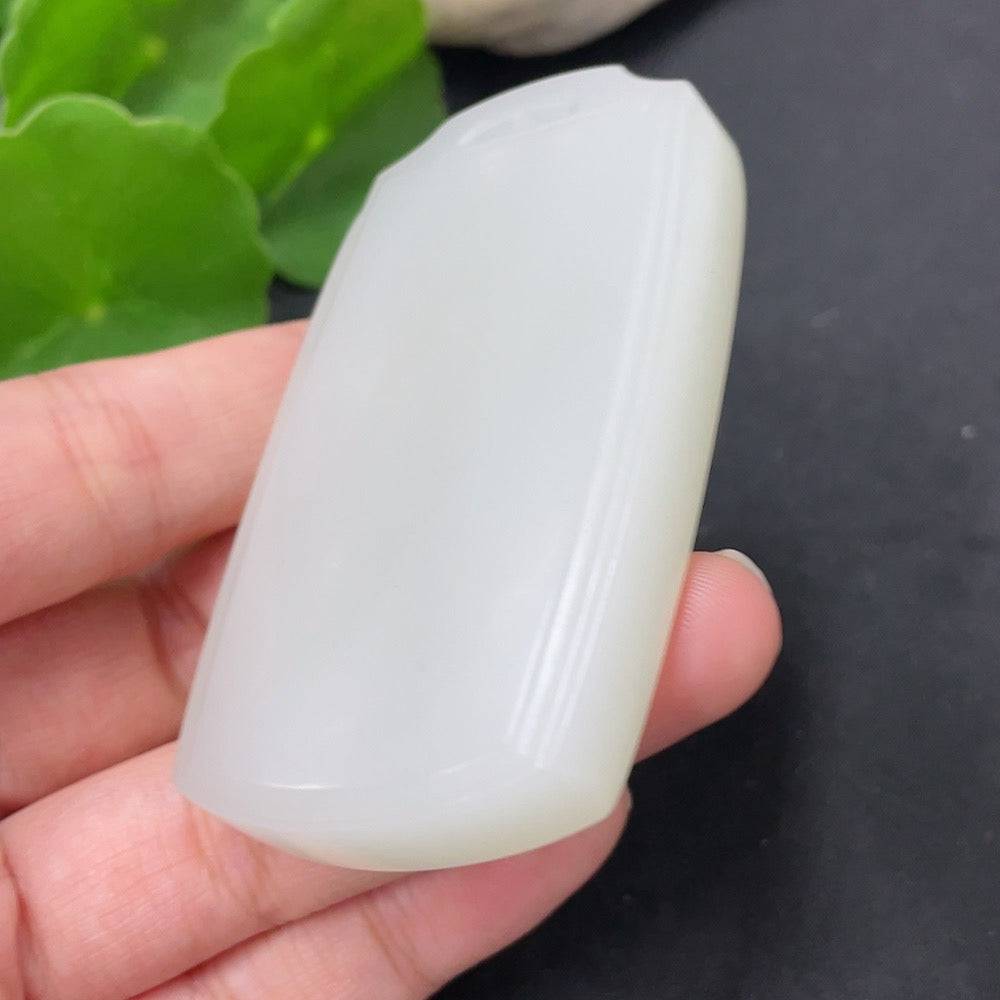 Huiliu certified Hetian jade pendant featuring a smooth, plain design showcasing the natural green jade stone.