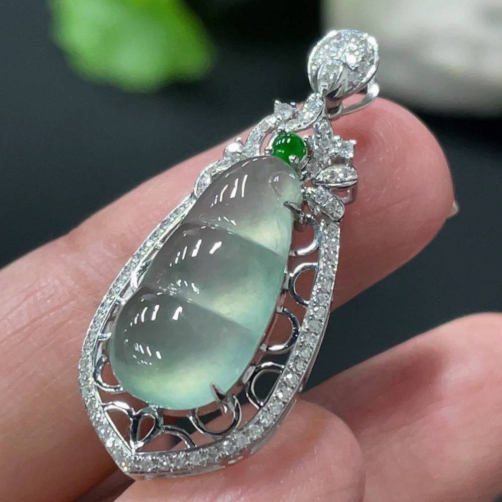 Jadeite blessing bean pendant with 18K gold setting and diamond accents, crafted by HUILIU HQ, weighs approximately 2.79g.