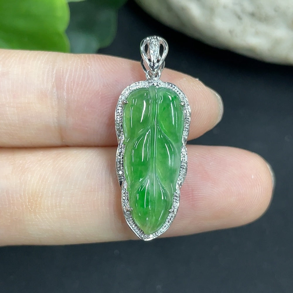 Jadeite leaf pendant necklace in 18K gold with diamond accents, elegant jewelry piece featuring detailed leaf design.