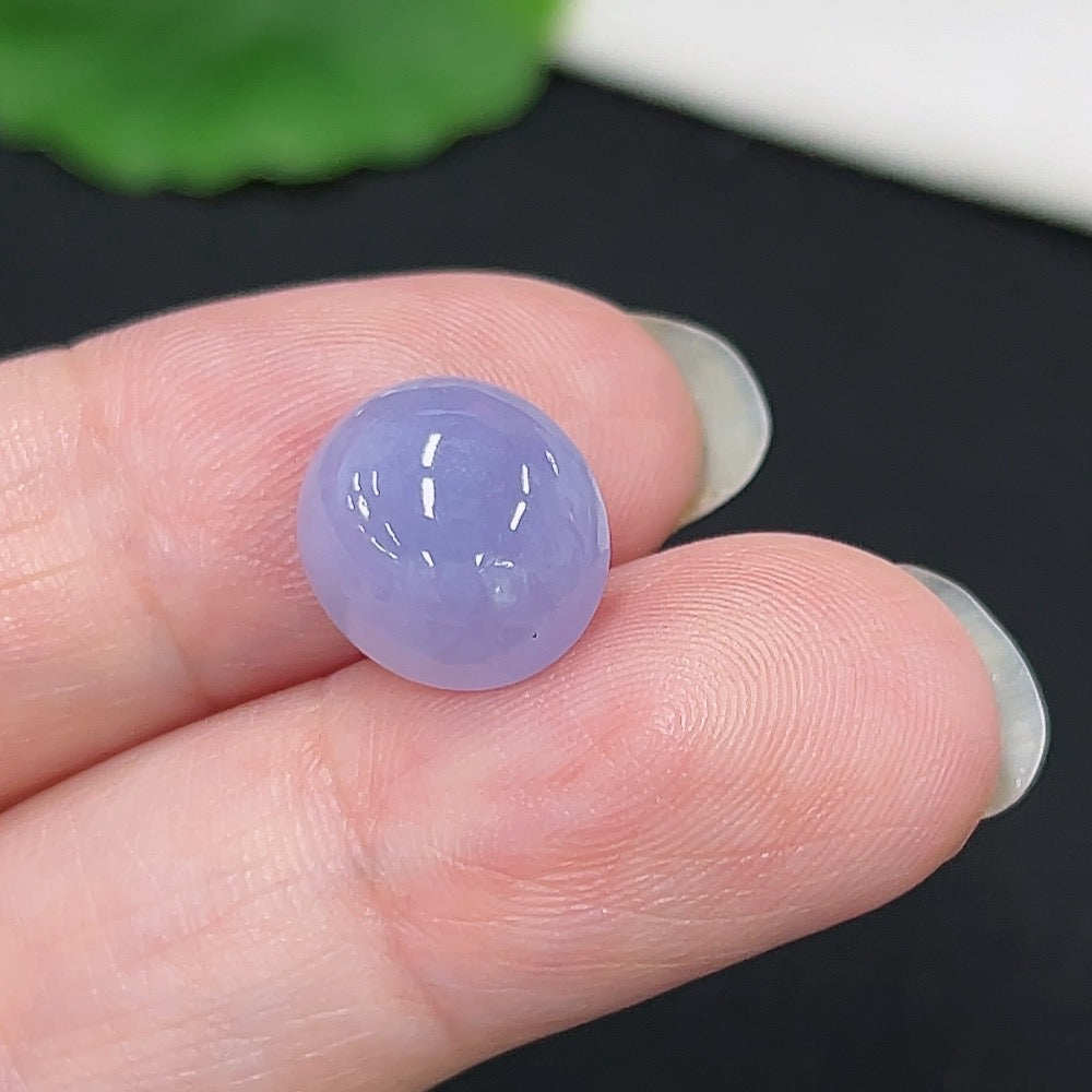 Jadeite cabochon inlay piece from HKHQ, approximately 1.12g, showcasing smooth, polished green jade with natural translucence.