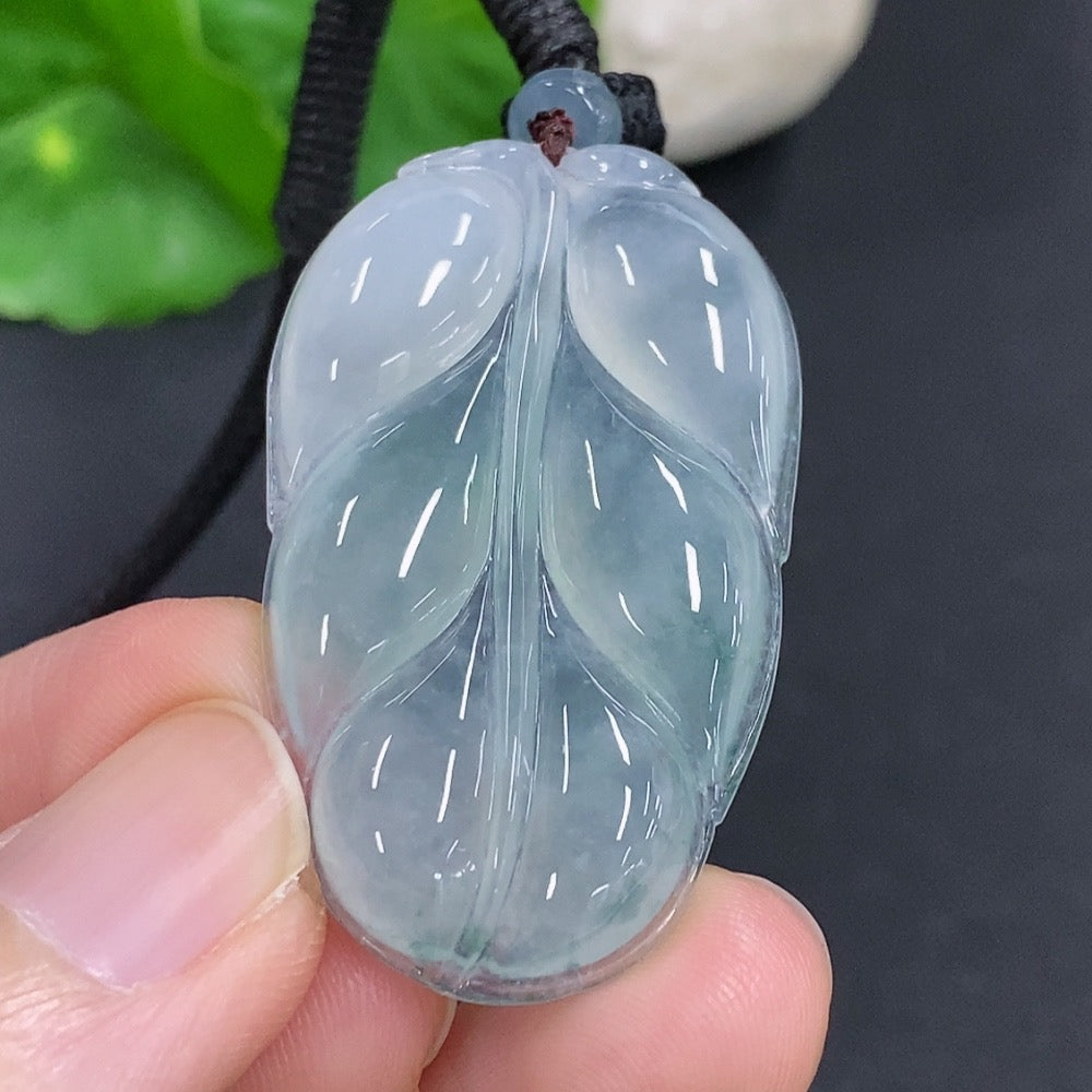 Jadeite leaf pendant necklace by HKHQ featuring a detailed green jade pendant on a silver chain.