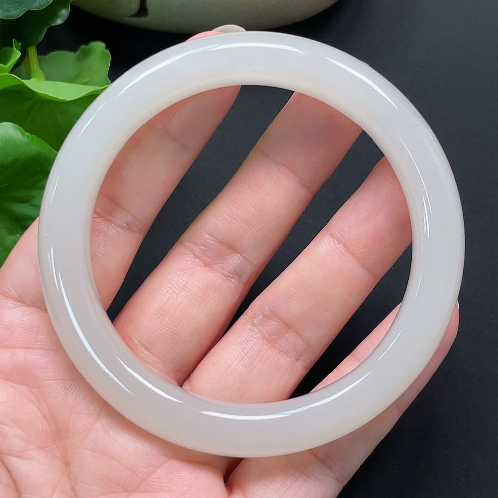 Hetian Jade round bracelet from HKHQ, 59.2mm diameter, weighing approximately 54g, showcasing smooth, polished jade stones.
