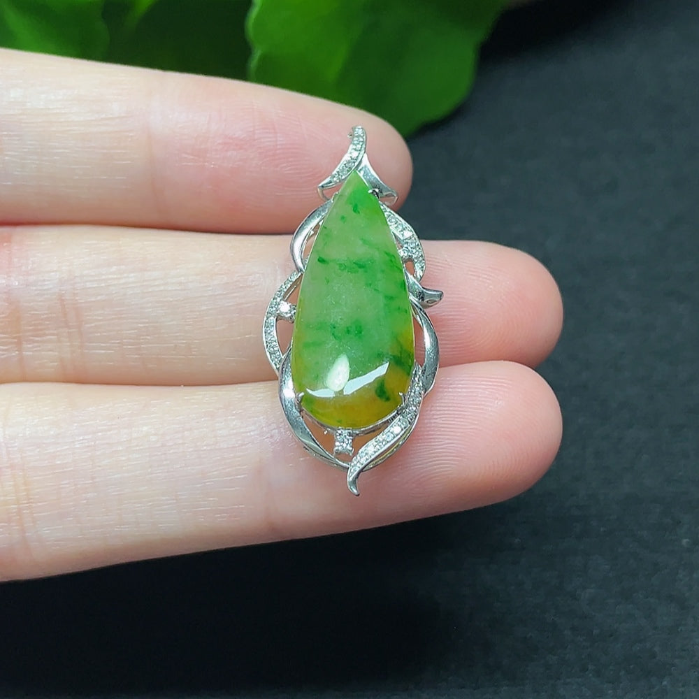 Jadeite teardrop pendant with 18K gold and diamond accents, elegant necklace featuring a polished gemstone and fine jewelry craftsmanship.