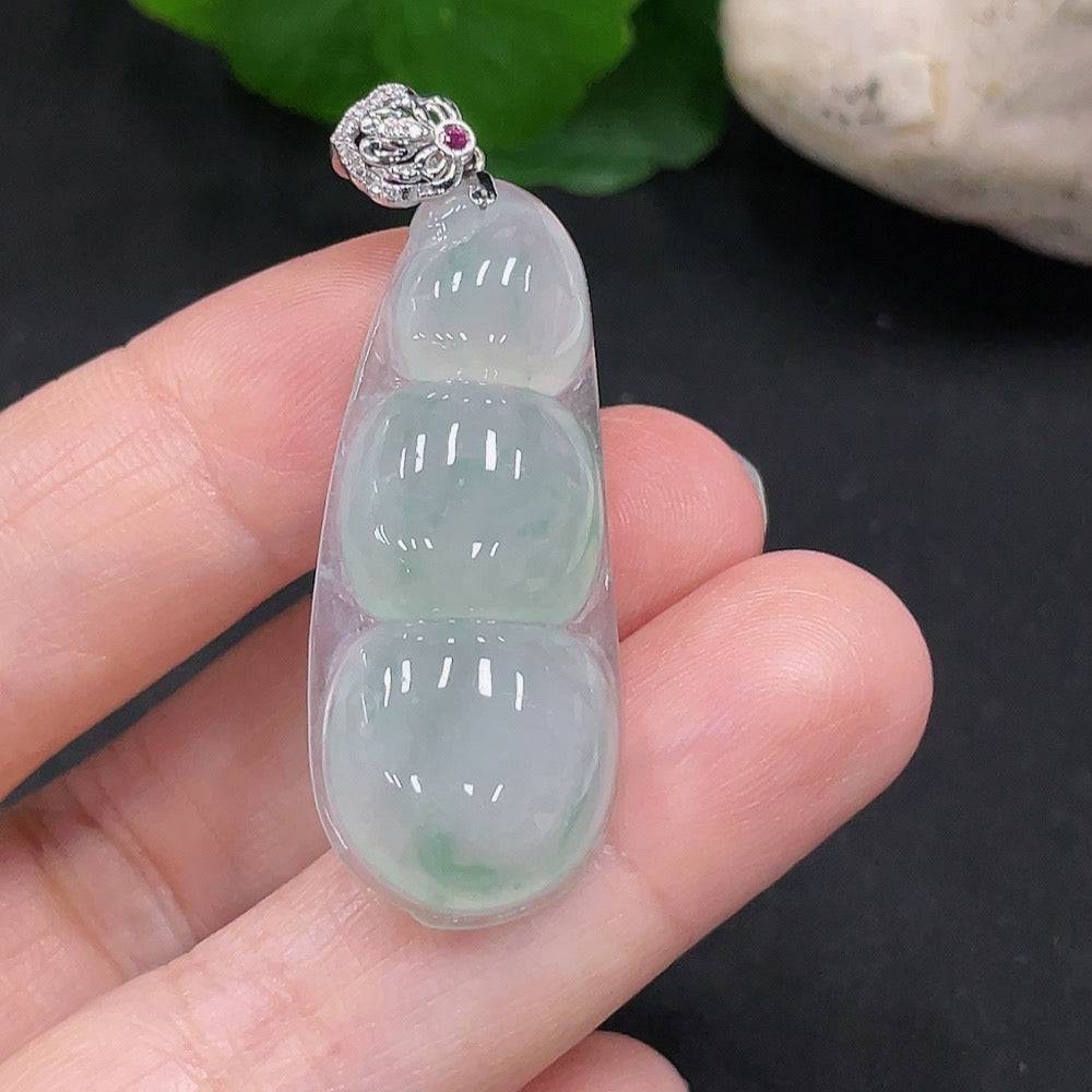 Jadeite lucky bean pendant with diamond accents in 18K gold, crafted by HUILIU HQ, showcasing intricate detailing and a polished finish.
