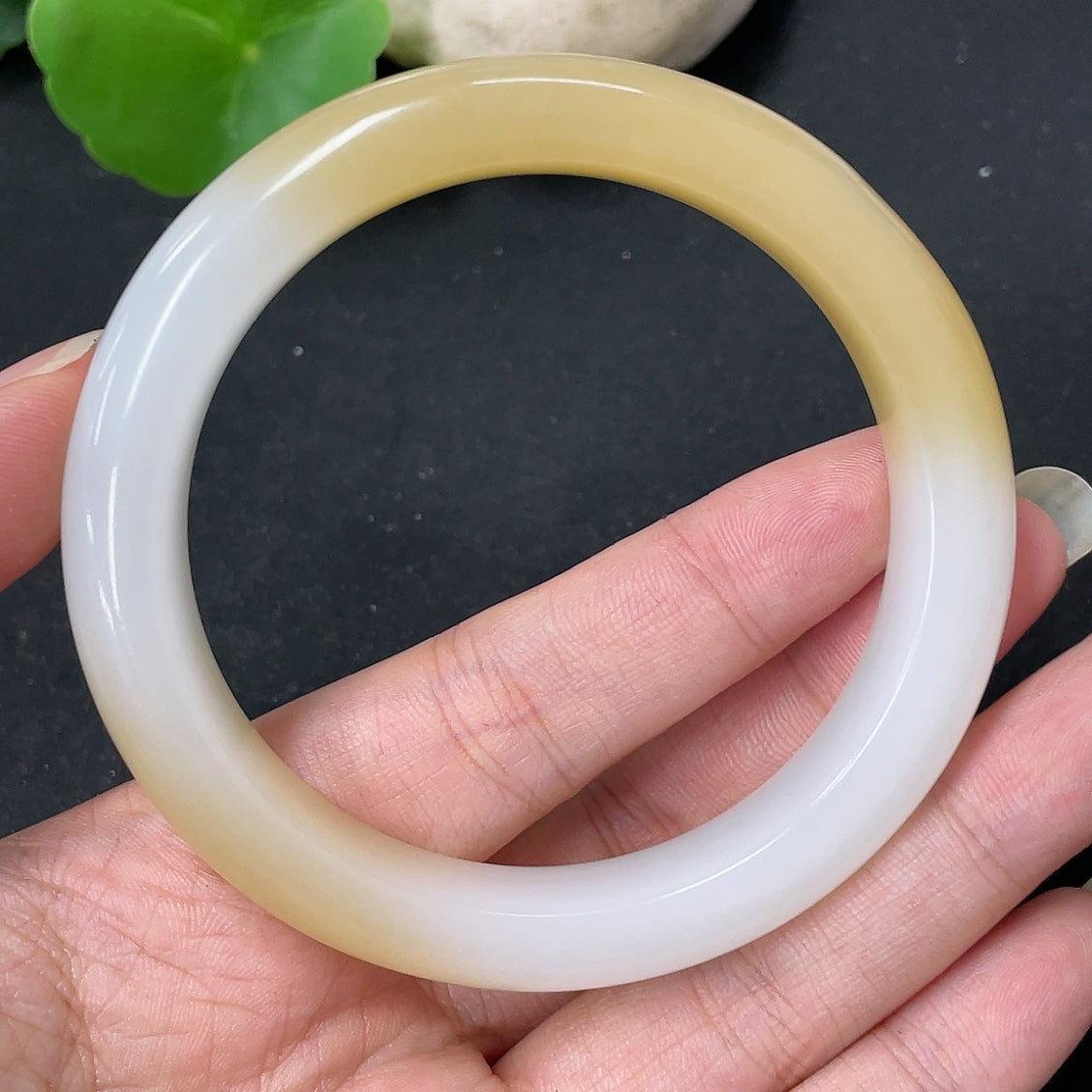 HKHQ Hetian Jade round bracelet, size 57.3, weighing approximately 52.5g, featuring smooth, polished jade beads.