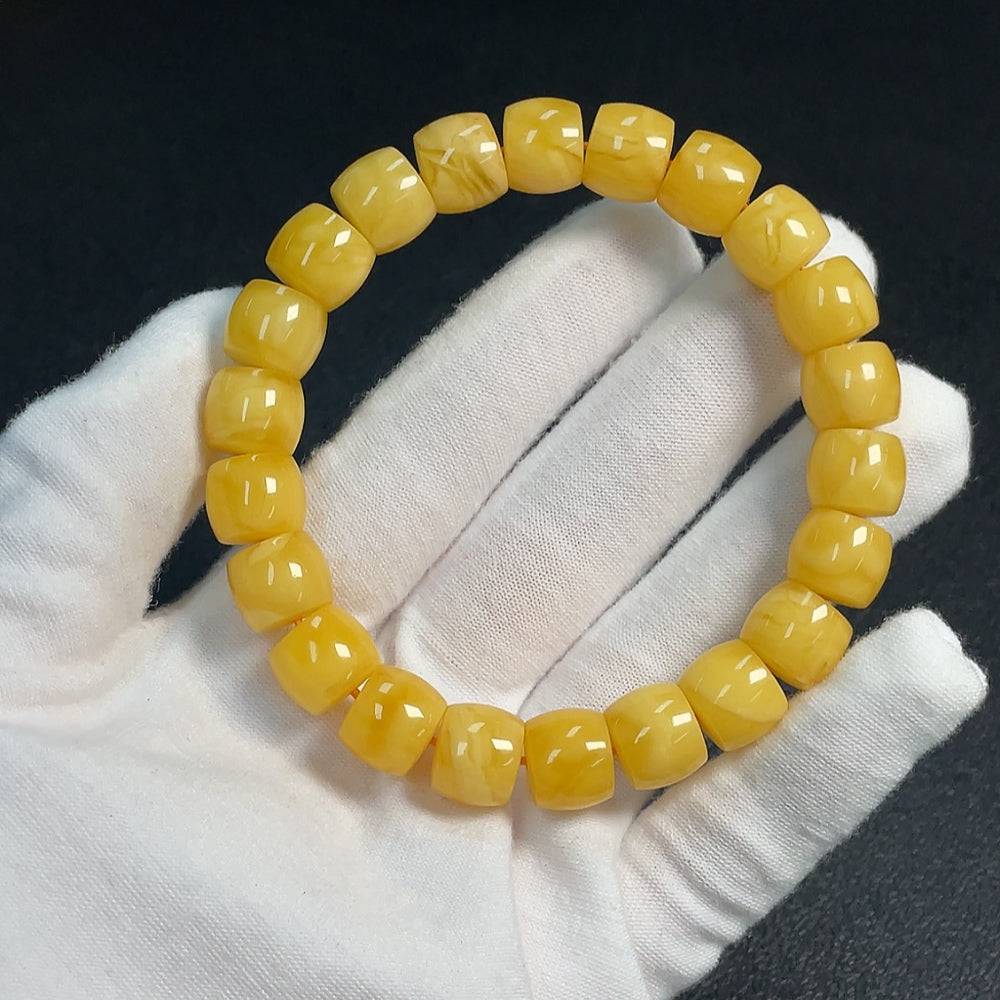 Huiliu Amber Beeswax Bracelet with 11.2mm beads, natural amber jewelry featuring warm honey tones and a polished finish.