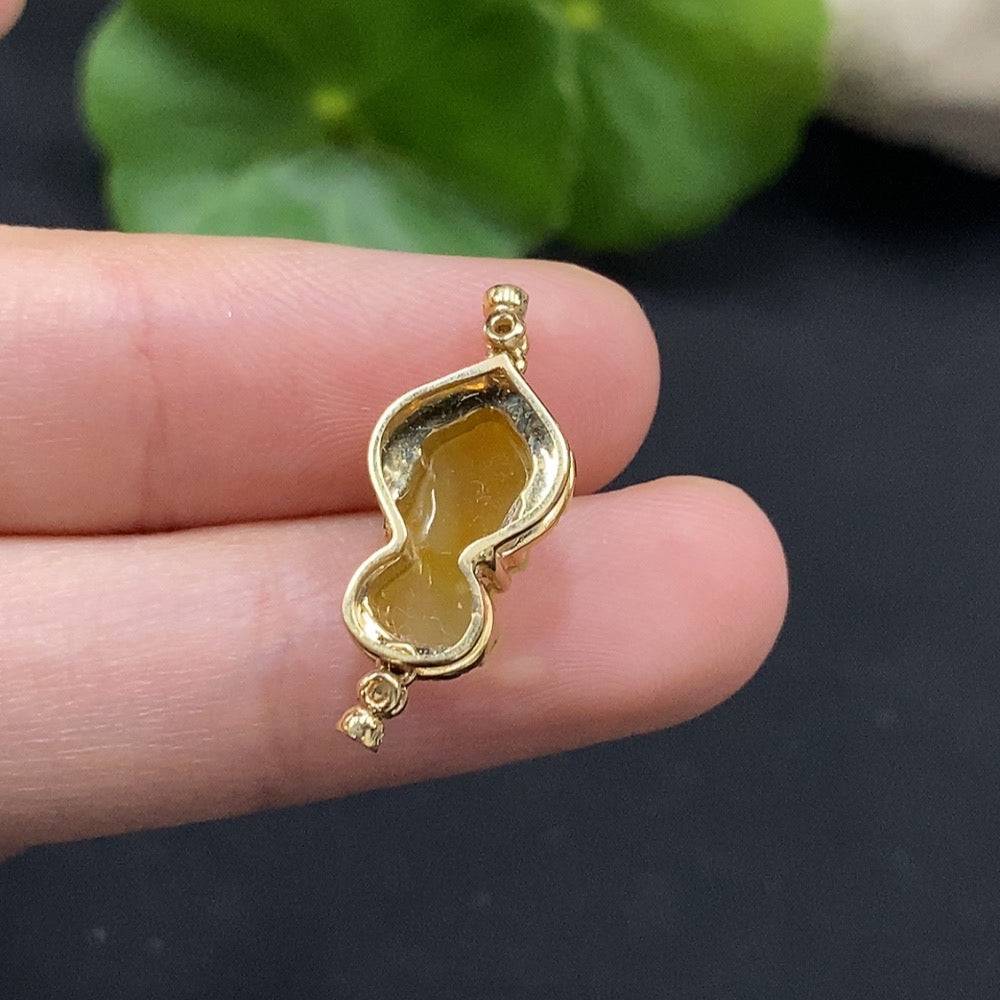 Huiliu Jadeite Baby Buddha pendant with diamond accents, inlaid design, no hallmark, tested for quality, about 1 inch long.