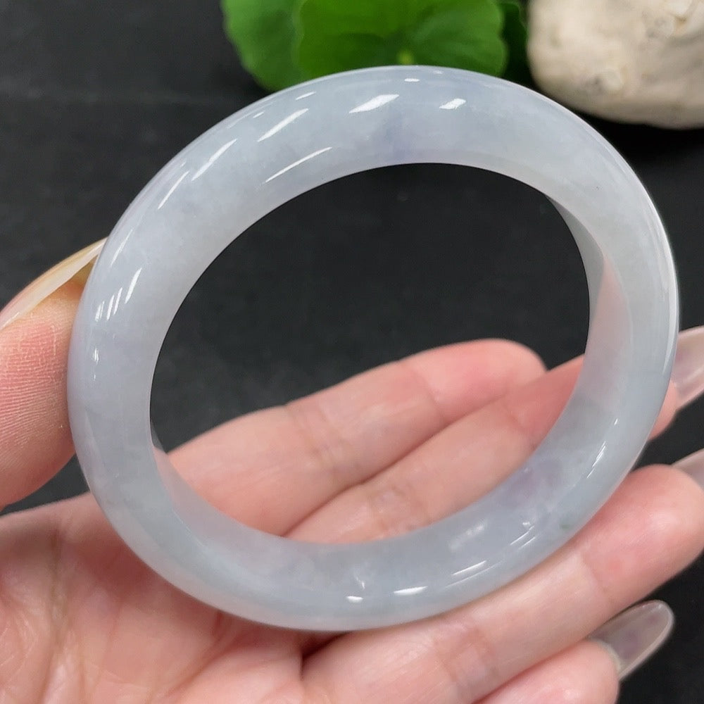 HUILIU HQ jadeite round bangle in size 55.7 with a total weight of 57.52g, showcasing smooth, polished jade surface.
