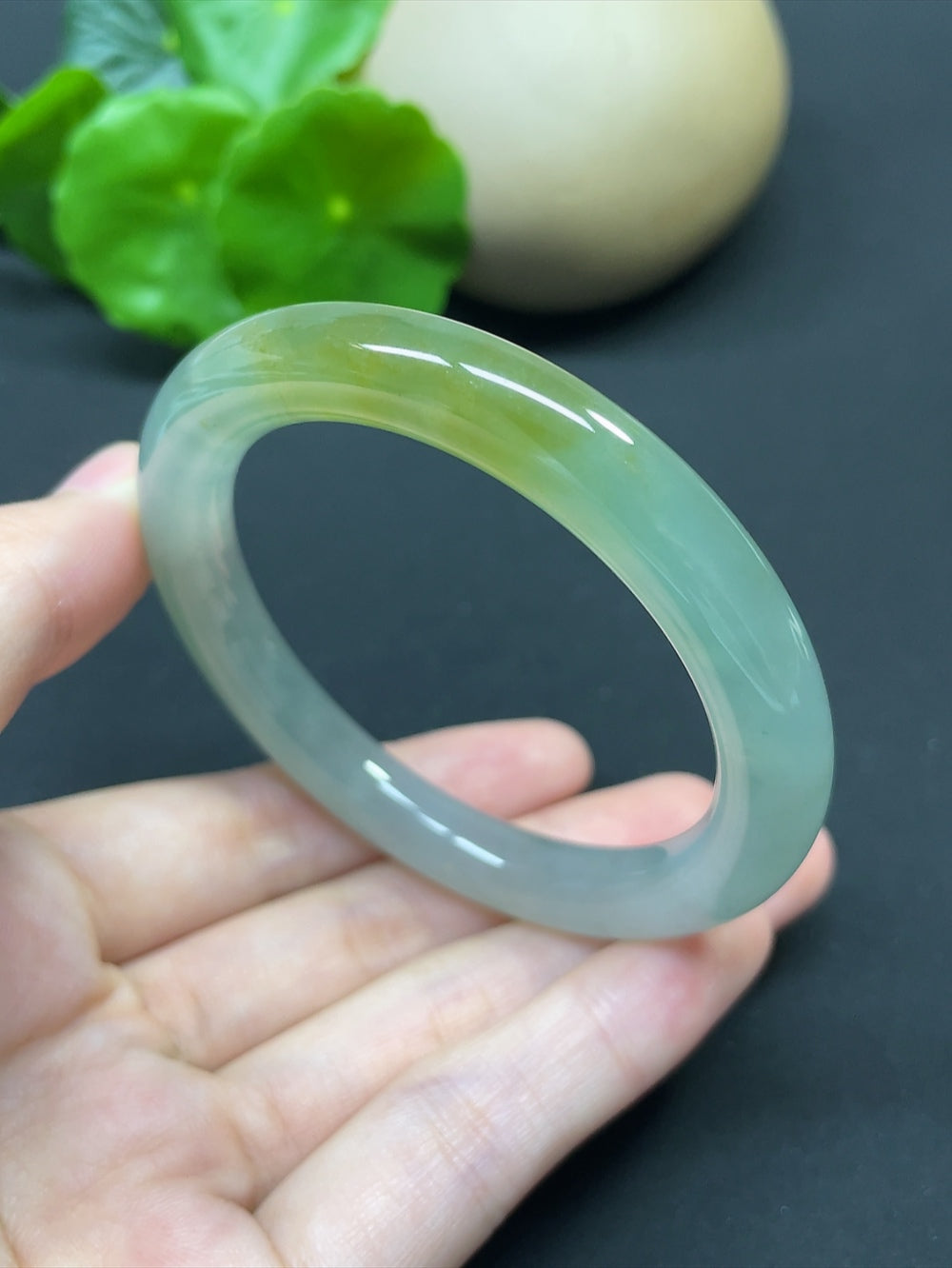 HKHQ jadeite round bangle in size 52.4 with a polished finish, weighing 41.46g, displayed on a neutral background.
