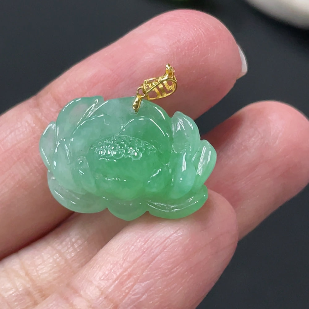 Jadeite lotus pendant with 18k gold clasp, approximately 3.38g, showcasing vibrant green jade and intricate lotus design.