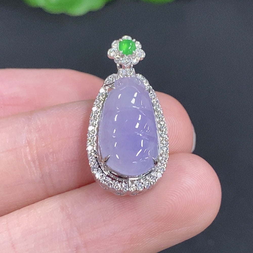 Jadeite lucky bean pendant with 18K gold accents and diamond details, showcasing a smooth, polished jade piece with intricate design.
