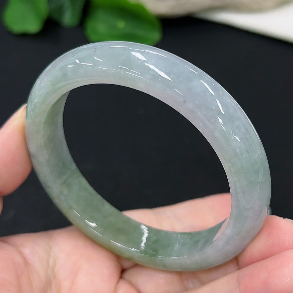 HKHQ jadeite round bangle in size 58, showcasing smooth, polished green jadeite with a sleek circular design.