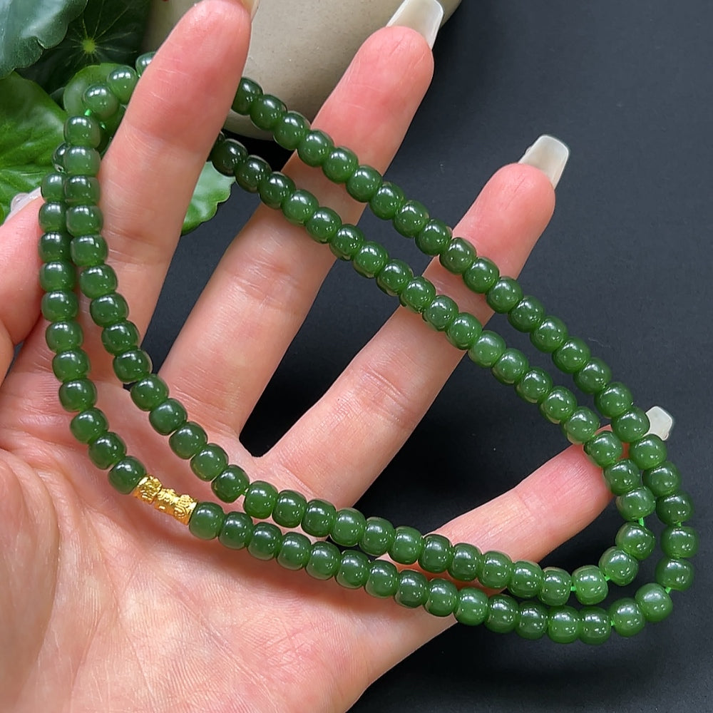 Hetian Jade bead necklace by HKHQ featuring 6.2mm smooth, non-gold jade beads on a delicate string.