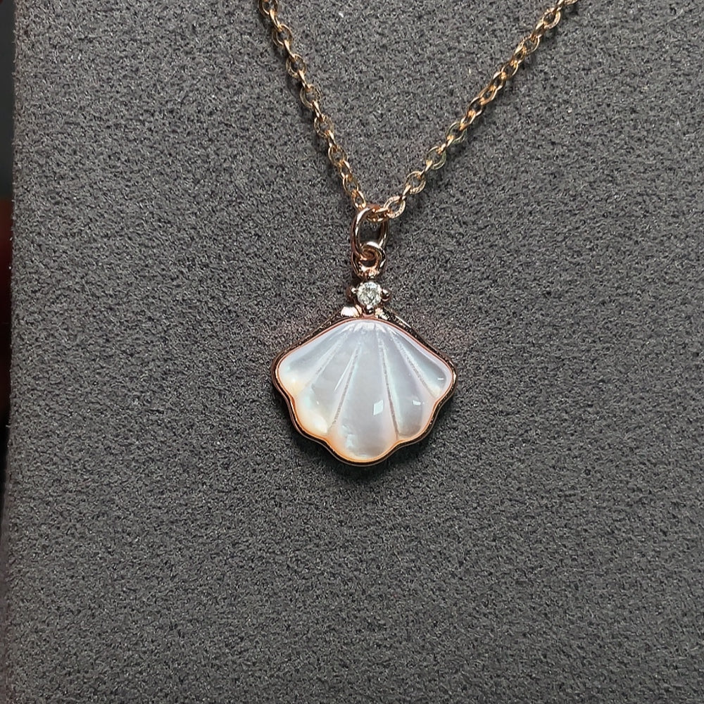 Shell pendant with diamond accents, 18K gold chain (pendant not gold), total weight approximately 2.72g including chain