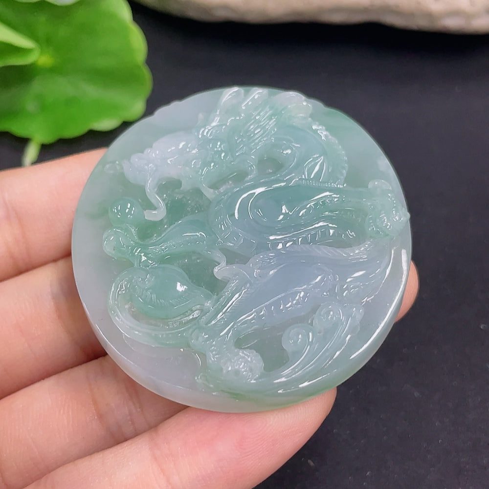 Jadeite dragon pendant necklace by HKHQ, intricately carved jadeite piece weighing 41.06g, displayed against a neutral background.