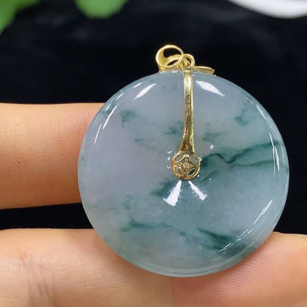 Huiliu Jadeite Peace Buckle Pendant featuring a carved jade design on a cord necklace, showcasing smooth, polished jade stone.