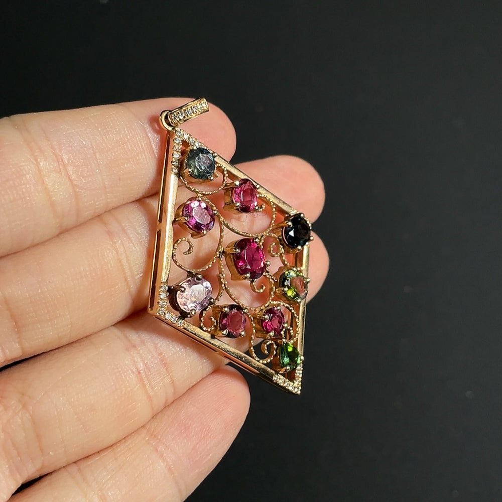Tourmaline pendant with spinel (light purple, gray blue) and diamond accents, 18k gold
