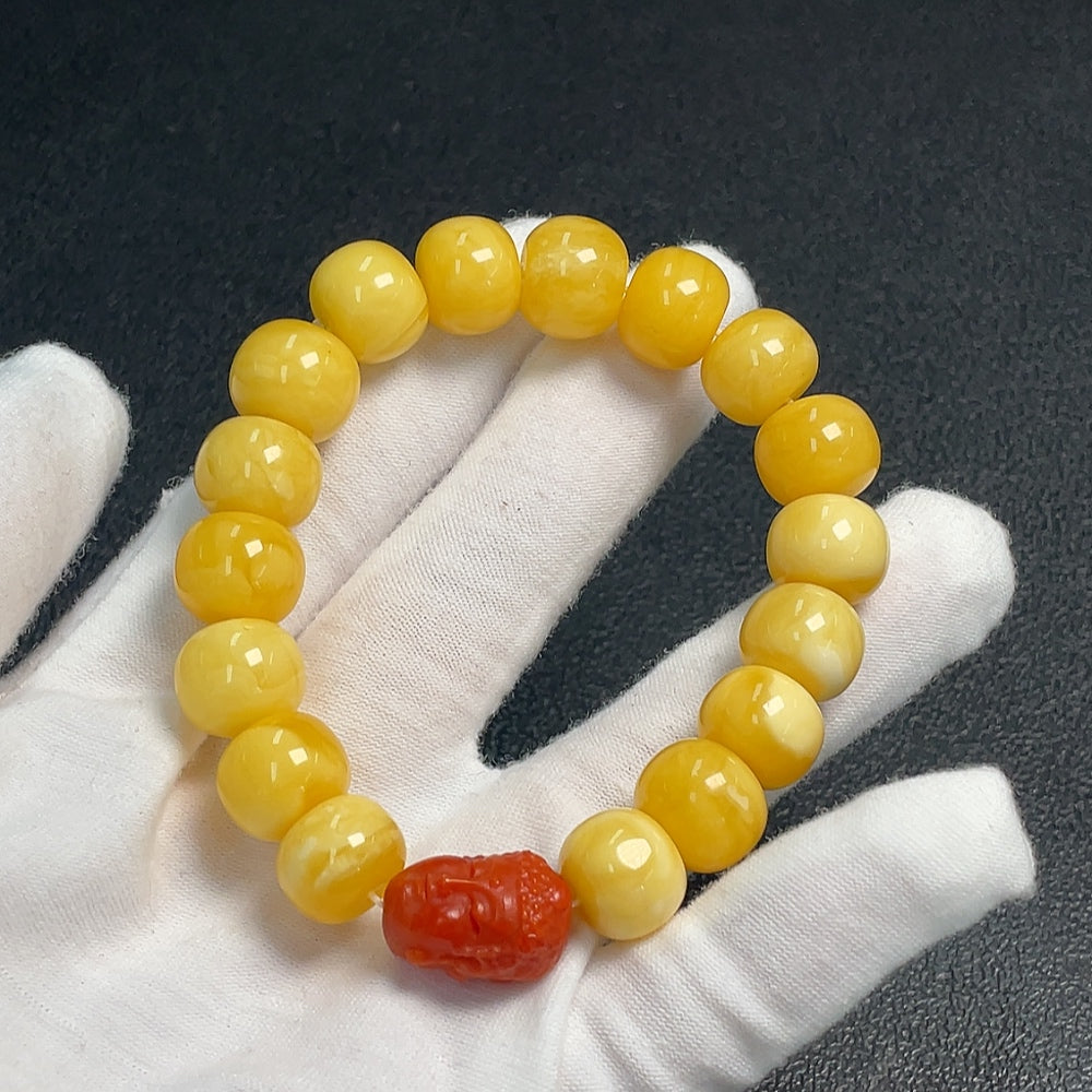 Amber beeswax bracelet with Southern Red Agate beads from HUILIU HQ, showcasing warm amber tones and vibrant red accents.