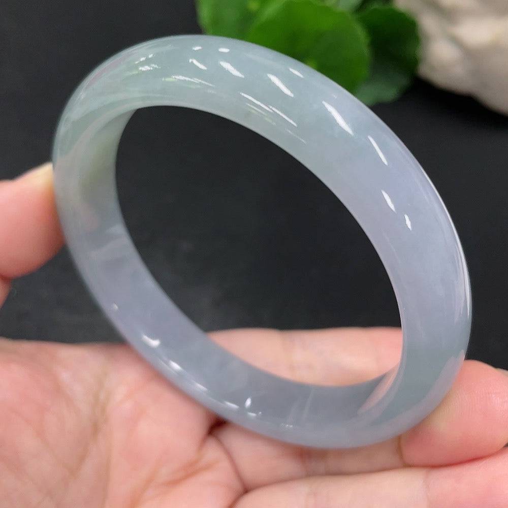 Jadeite round bracelet with size 60, weighing approximately 54.2g, featuring smooth jade beads on a stretch cord.
