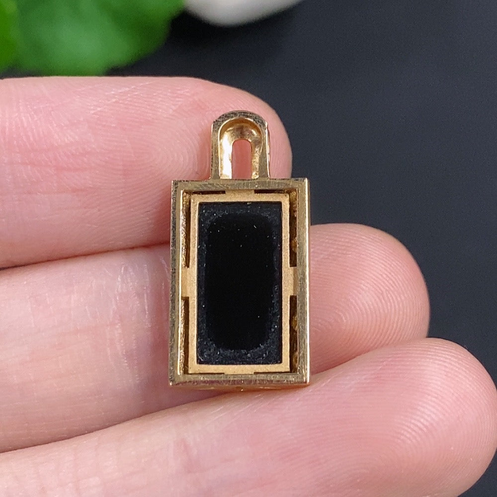 Jadeite inlaid pendant necklace with 18K gold and diamond accents, showcasing intricate craftsmanship and elegant design.