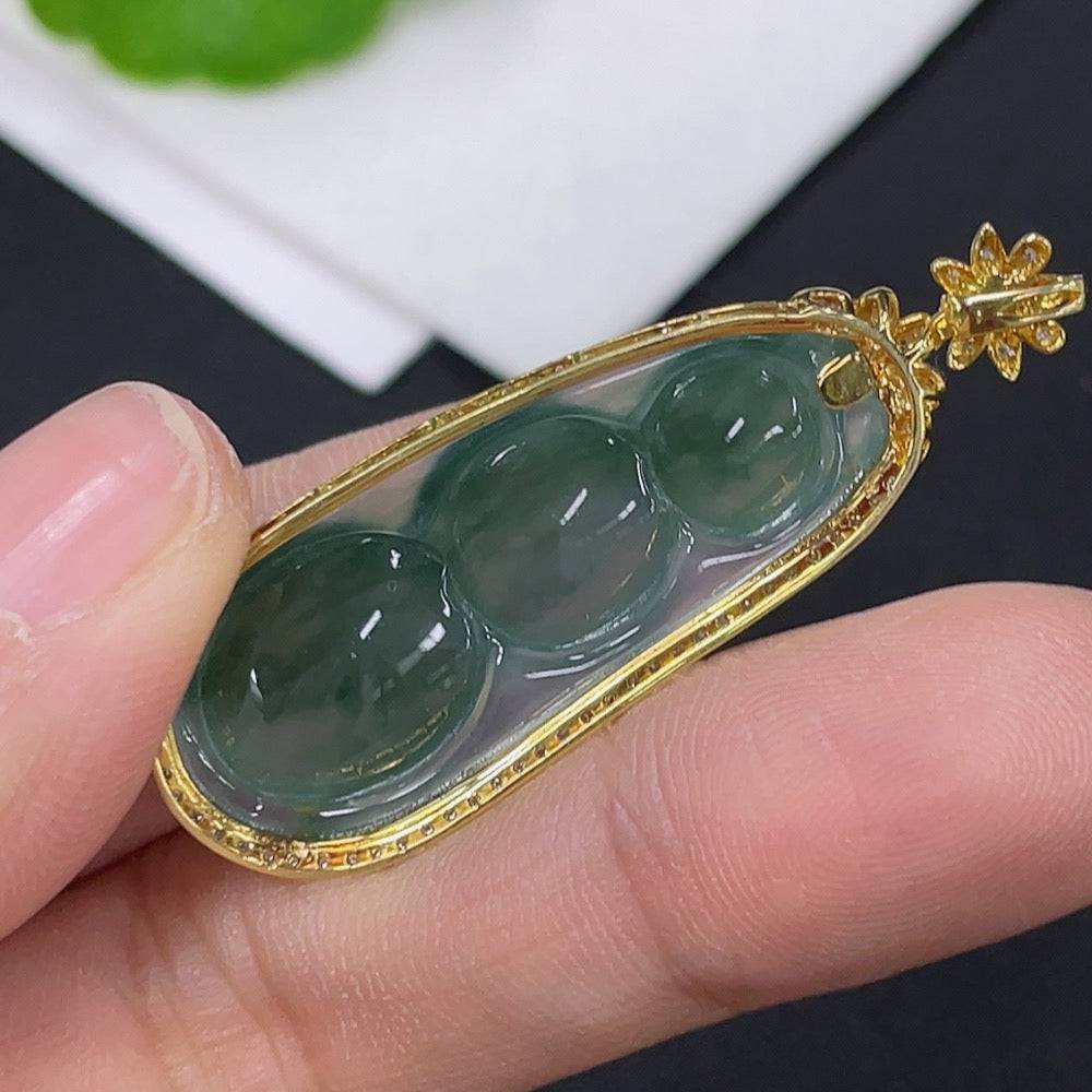 Huiliu Jadeite lucky bean pendant with diamond accents, inlaid with intricate jade craftsmanship, featuring a polished, detailed design.