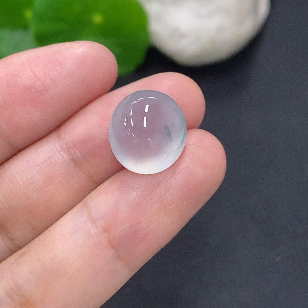 Jadeite cabochon jewelry piece weighing 2.2g with smooth, polished surface showcasing vibrant green color and natural stone details.