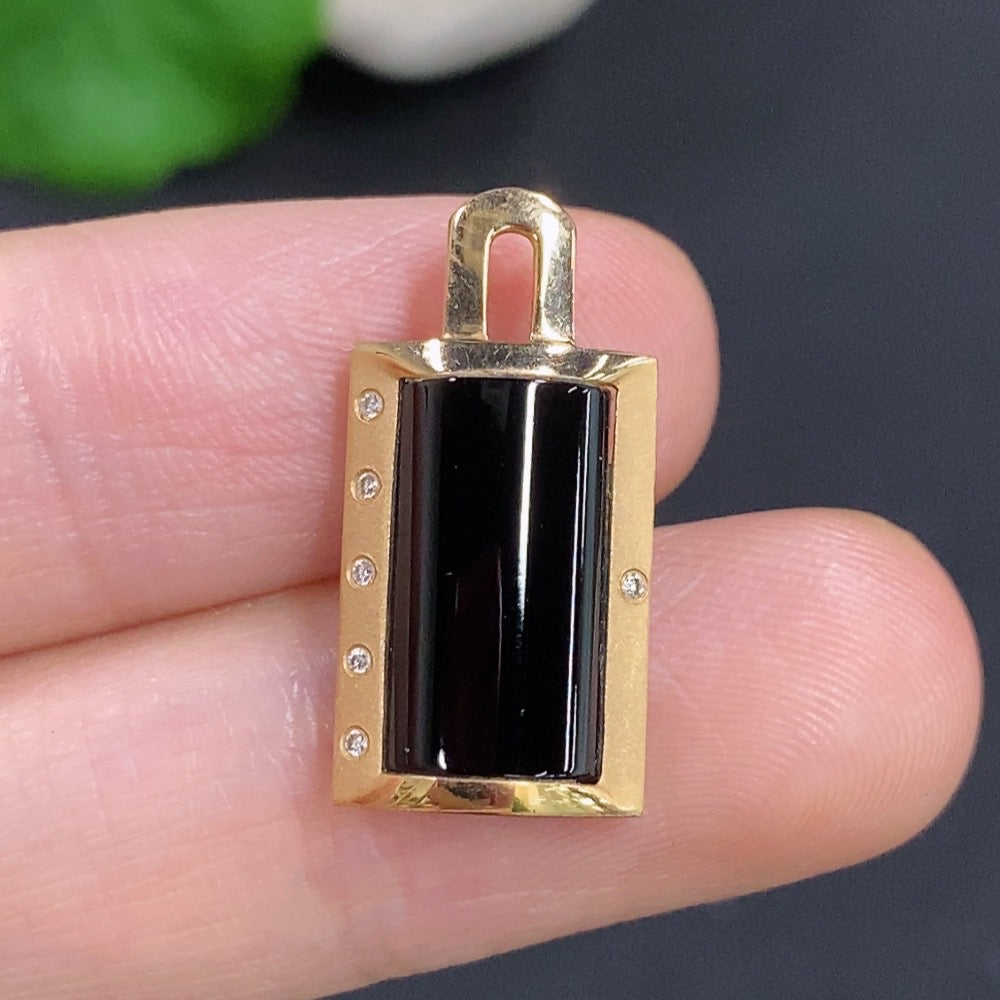 Jadeite inlaid pendant with 18K gold and diamond accents, featuring intricate craftsmanship and elegant design.