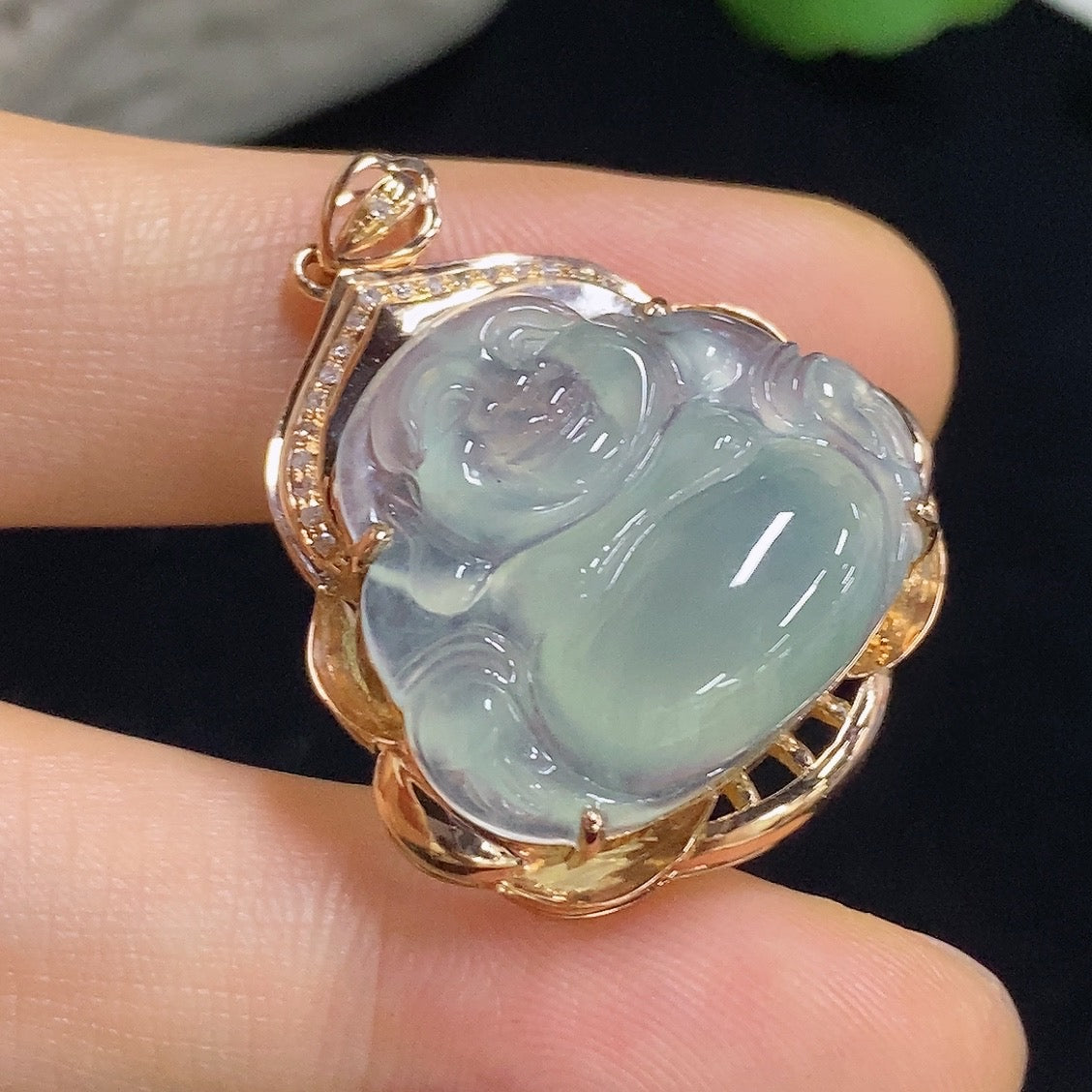 Jadeite Buddha pendant with 18k gold accents and diamond details, crafted from green jade, weighing approximately 5.65g.