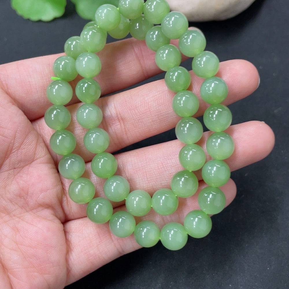 Hetian Jade bead necklace with 7.6mm jade beads from HUILIU HQ, weighing approximately 33.6g, displayed on a neutral background.
