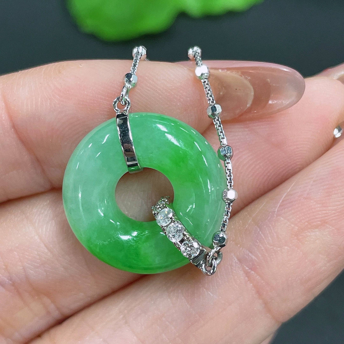 HUILIU HQ jadeite pendant in 18k gold with diamond inlays, showcasing intricate craftsmanship and elegant design.