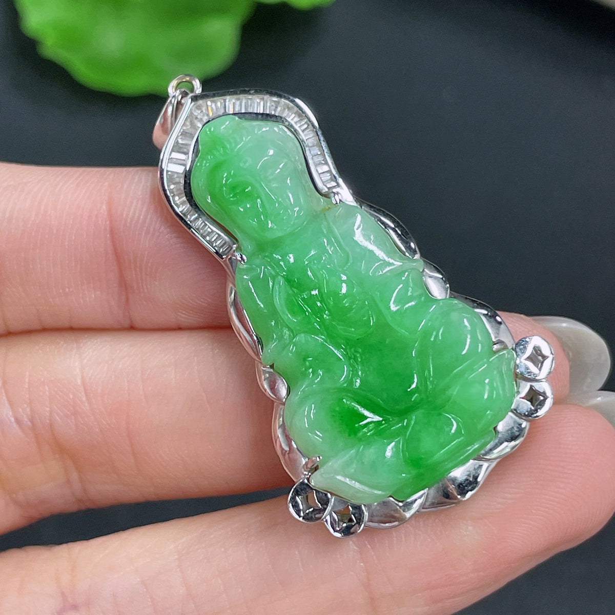 Jadeite Guanyin pendant in 18k gold with no diamonds, featuring detailed carved figure, weighs approximately 9.36g.