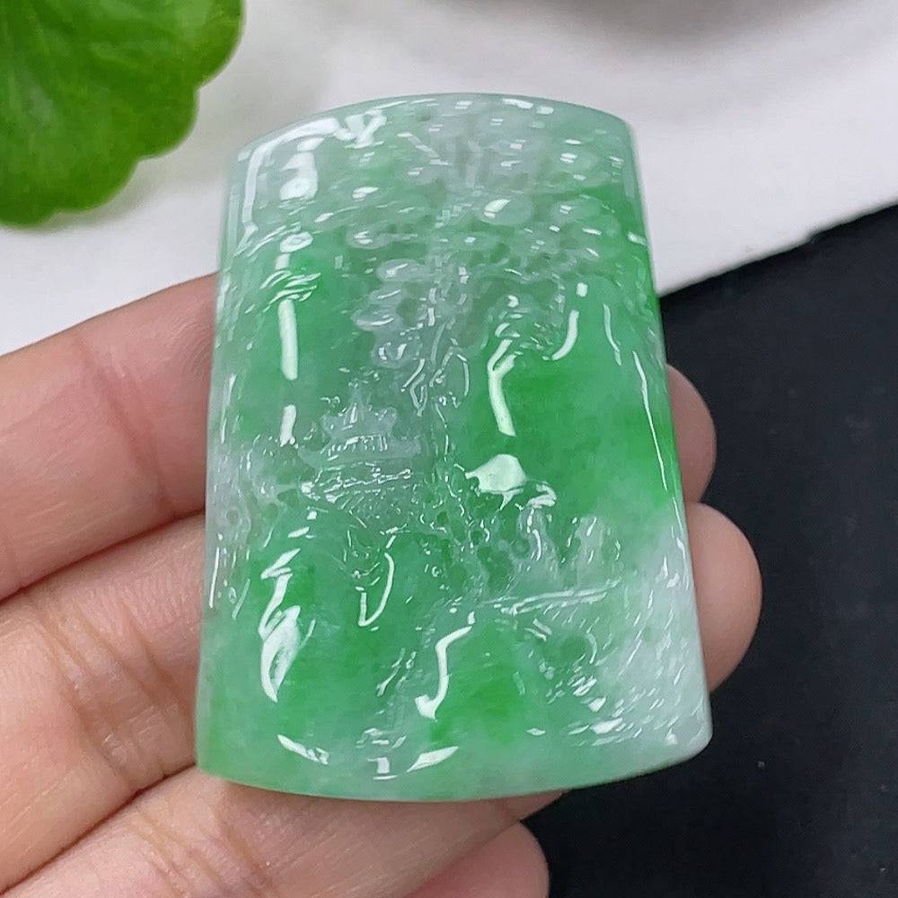 Jadeite pendant with landscape design, HUILIU HQ brand, weighs approximately 16.93g, featuring detailed carved scenery on green jade.