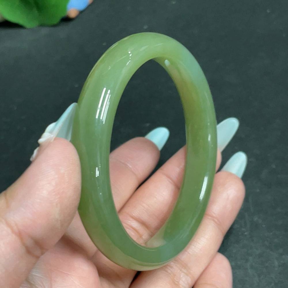 Huiliu certified Hetian jade round bracelet featuring smooth, polished green jade beads on a string, elegant and handcrafted.
