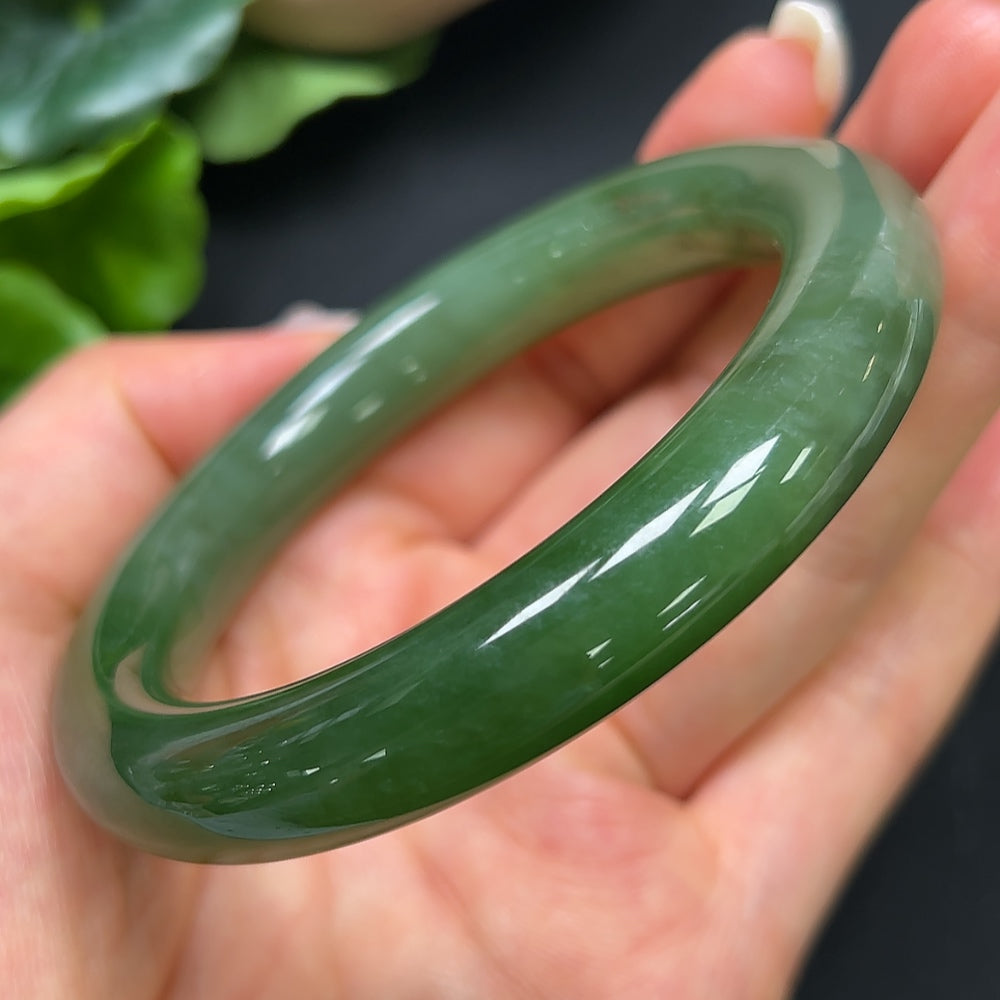 HKHQ Hetian Jade round bangle with size 55.4 and weight 56.99g, showcasing smooth, polished jade bracelet with natural green hues.