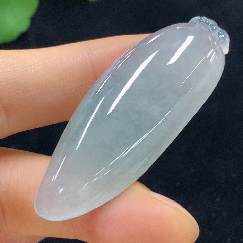 Huiliu Jadeite Blessing Melon Pendant featuring detailed jade carving on a polished green jade gemstone.