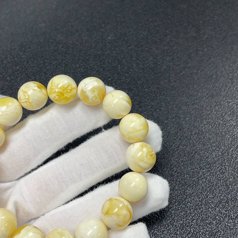 Huiliu Amber Beeswax bracelet with 12.3mm size beads, natural amber jewelry featuring warm, golden hues and handcrafted design.