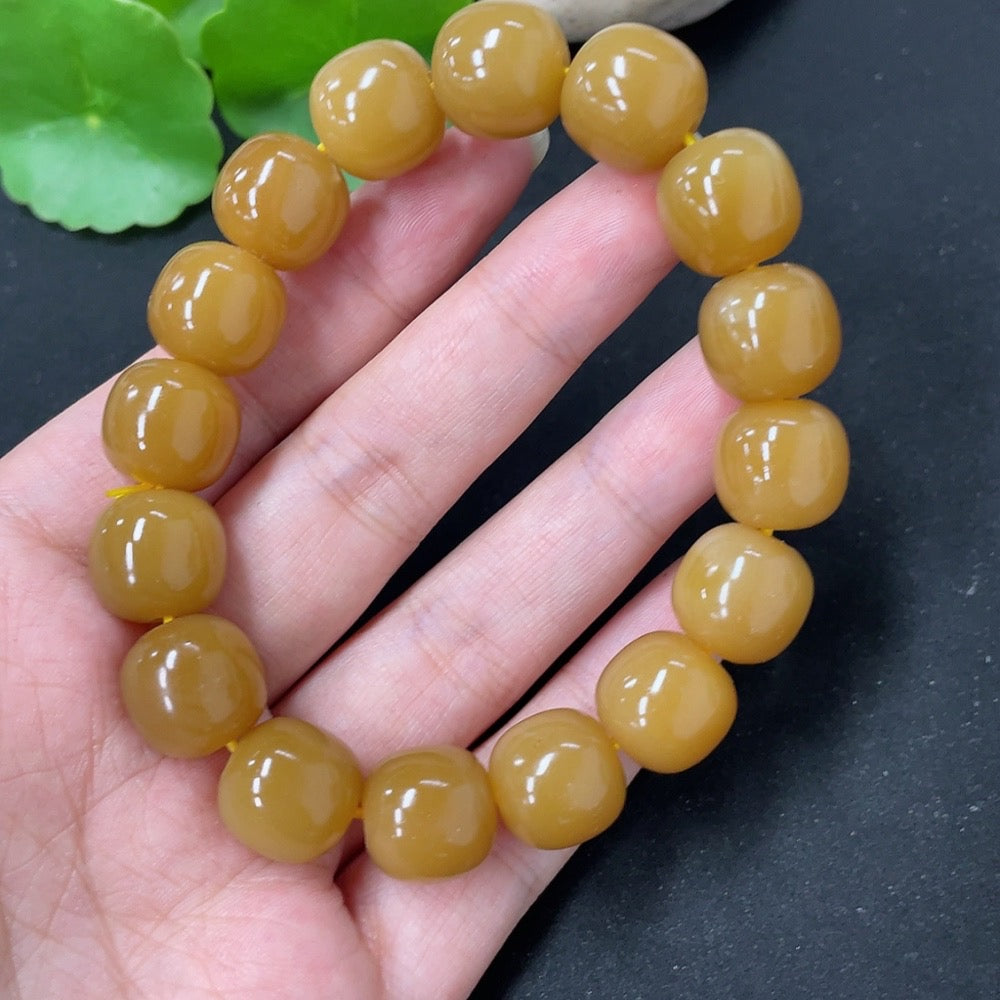 HKHQ Hetian Jade bracelet featuring smooth, polished green jade beads, weighing 58.5g, displayed on a neutral background.