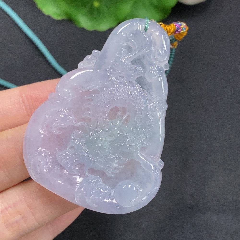 Huiliu Jadeite Dragon Pendant featuring a soaring dragon design, crafted from green jade with detailed carvings.