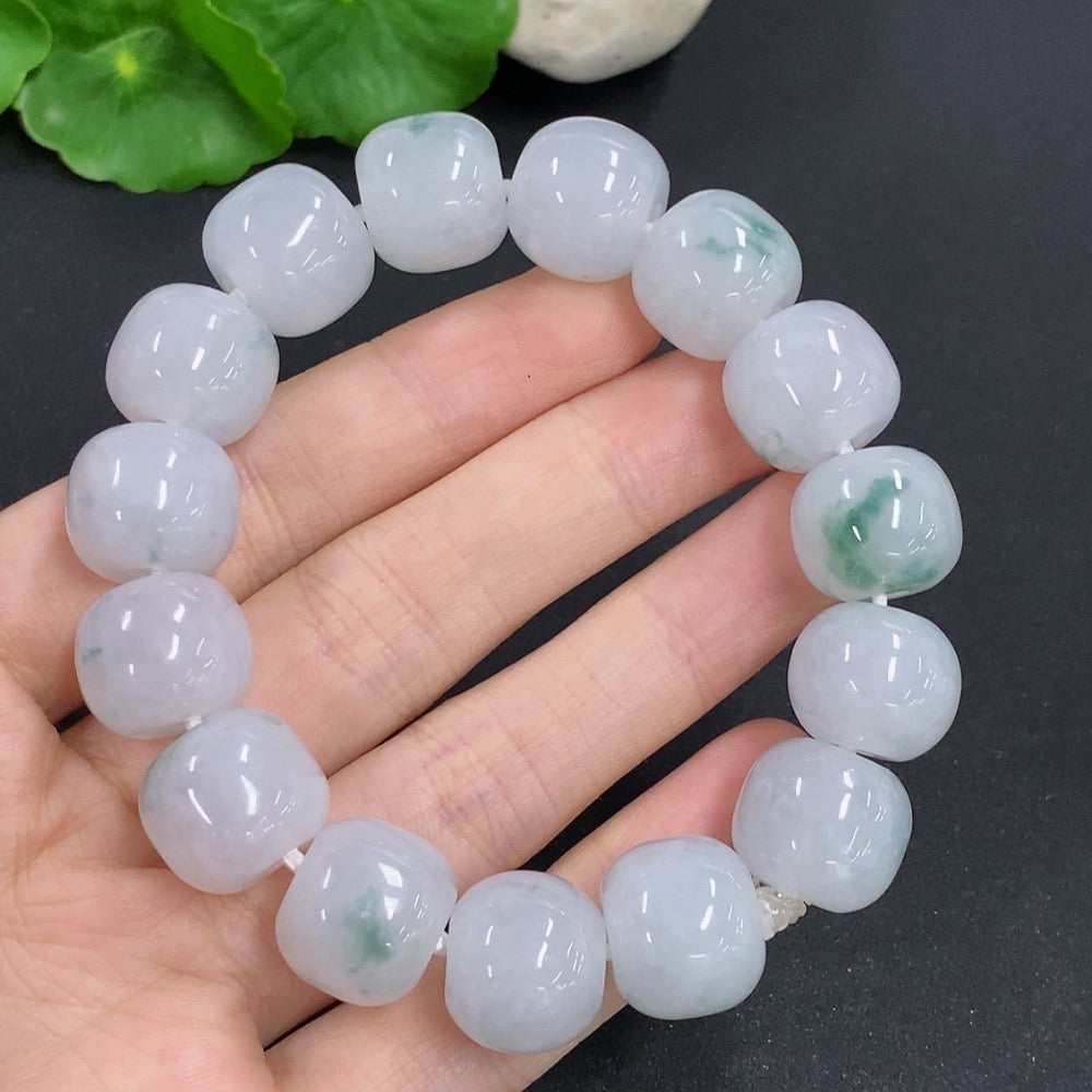 HKHQ jadeite bracelet weighing 83.3g, featuring smooth, polished jadeite beads on a stylish bracelet design.