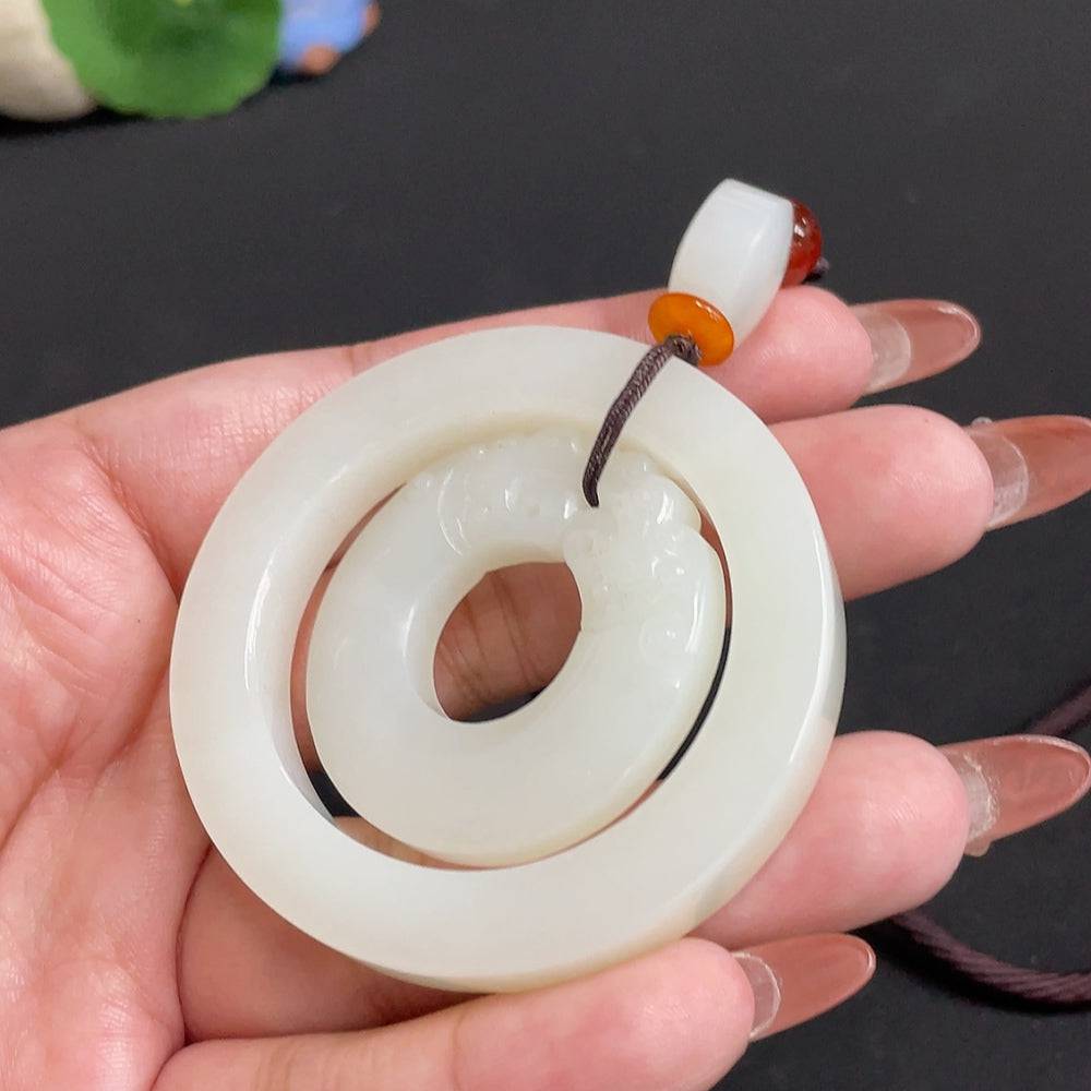 Antique-style Hetian Jade pendant with beads, weight 55.4g, featuring a detailed carved design and attached to a matching rope.
