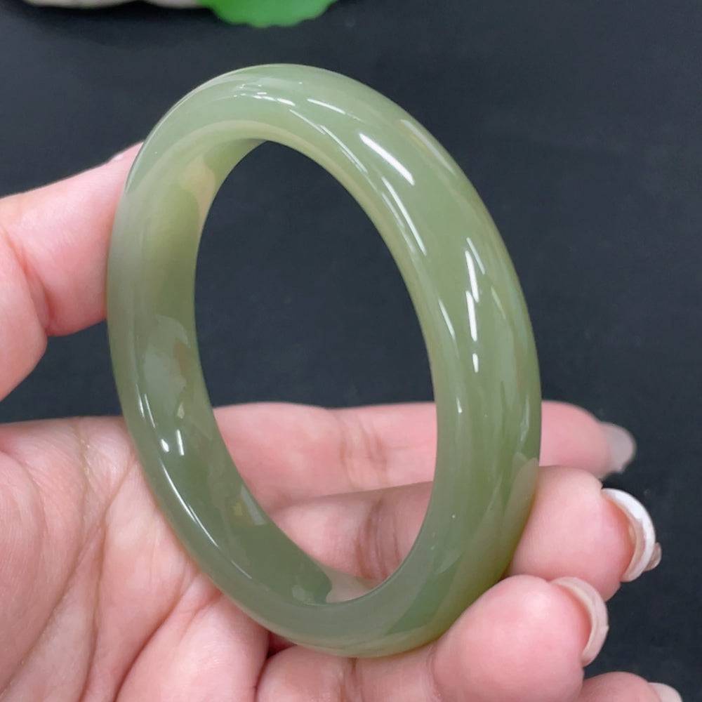 Huiliu certified Hetian Jade round bracelet featuring smooth, polished jade beads on a delicate string.