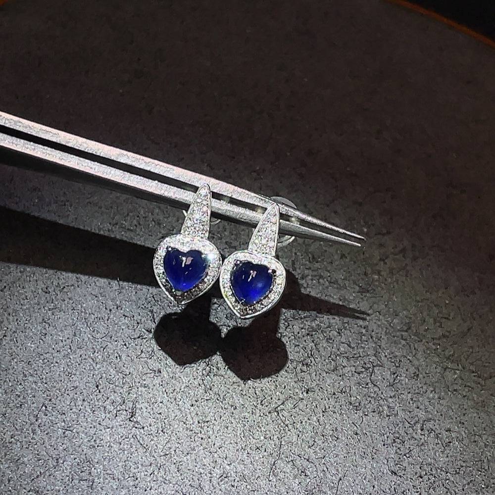 Huiliu sapphire earrings with diamond accents, showcasing vibrant blue gemstones and sparkling diamonds in a elegant jewelry design.