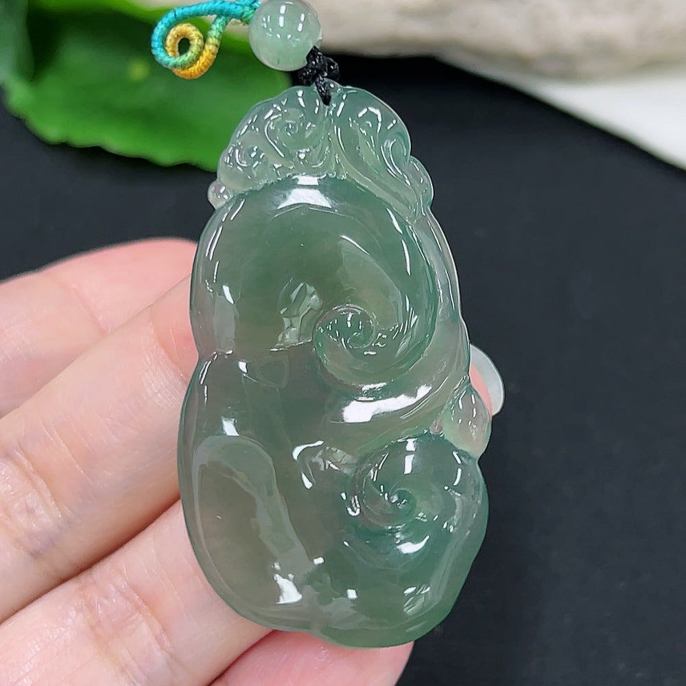 Jadeite Ruyi pendant from HKHQ, intricately carved jade jewelry, approximately 13.4g, showcasing smooth, polished surface and detailed craftsmanship.