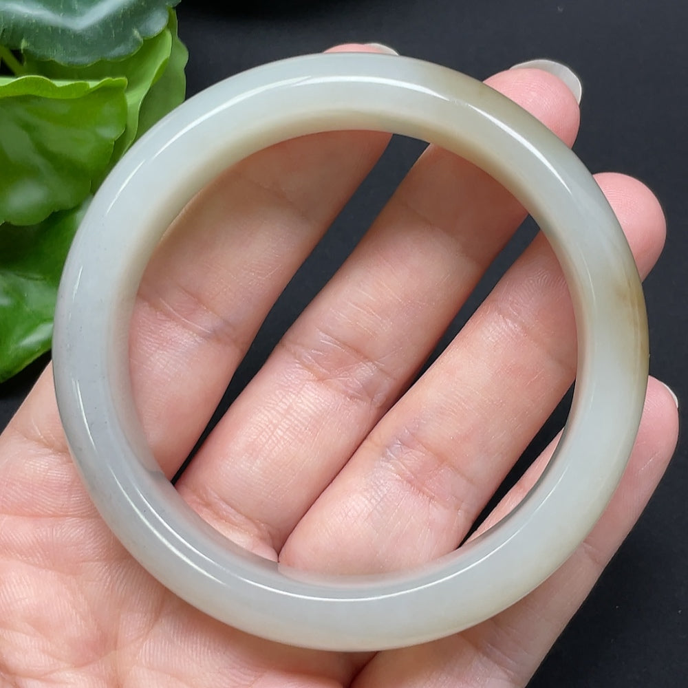 HKHQ Hetian Jade round bangle, size 53.9, weighs 54.46g, showcasing smooth, polished green jade bracelet on a plain background.