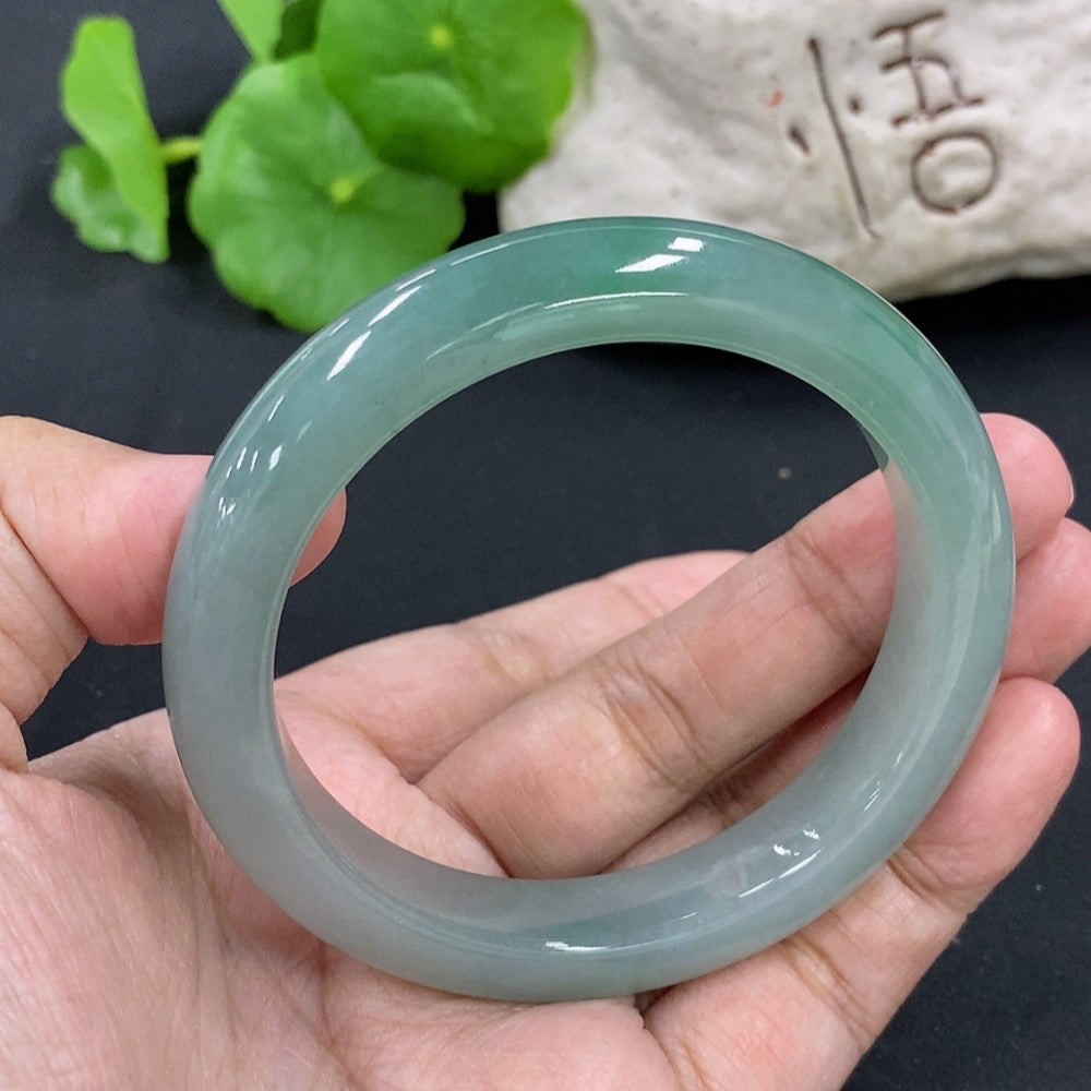 HKHQ jadeite round bangle in size 55.5, weighing 53.26g, showcasing a smooth, polished jadeite bracelet on a neutral background.