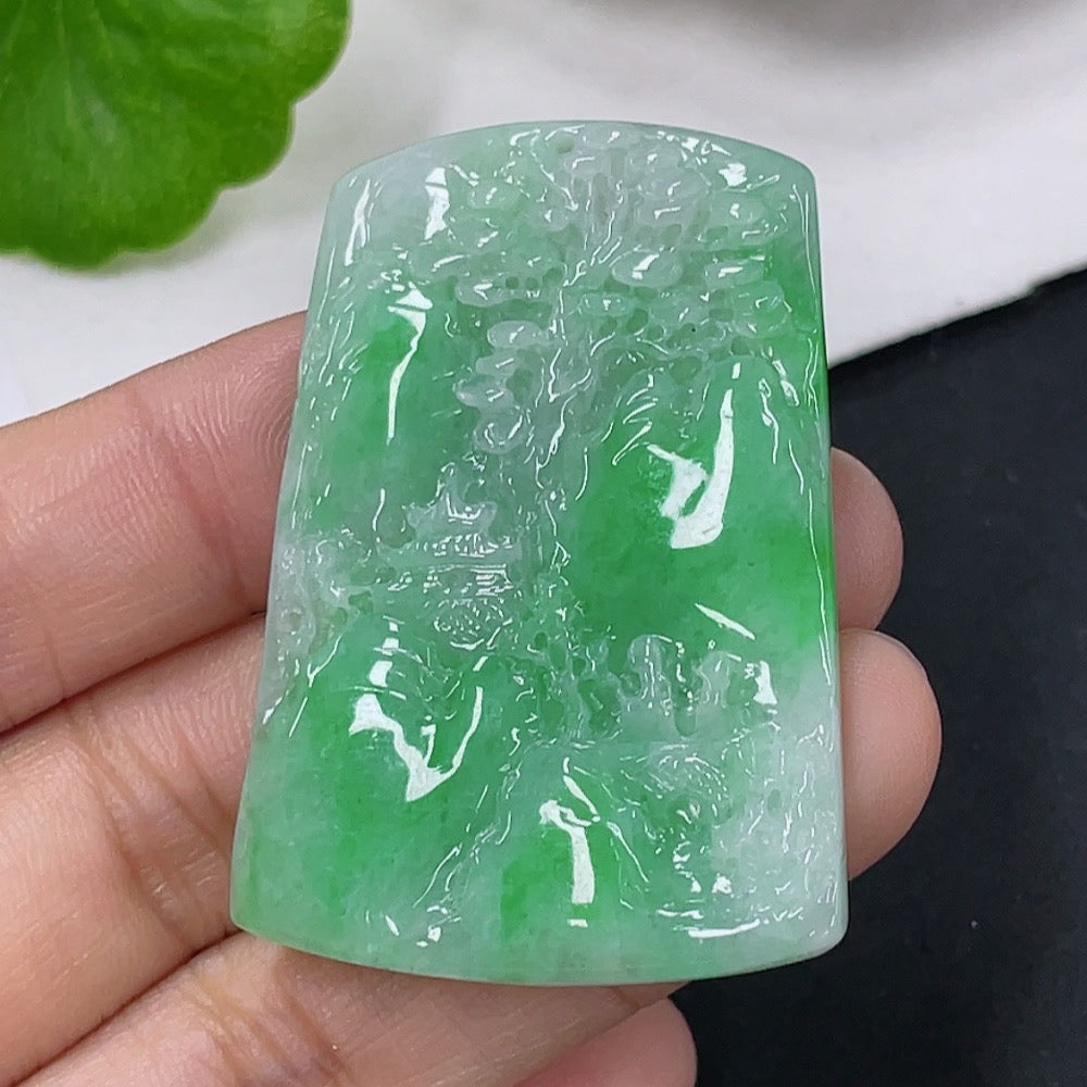 Jadeite pendant featuring a landscape design, weighing approximately 16.93 grams, crafted by HUILIU HQ, with detailed natural jade appearance.