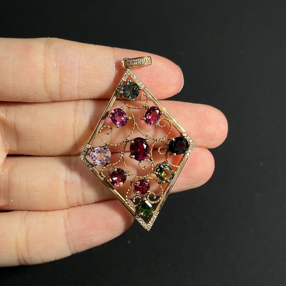 Tourmaline pendant with spinel (light purple, gray blue) and diamond accents, 18k gold