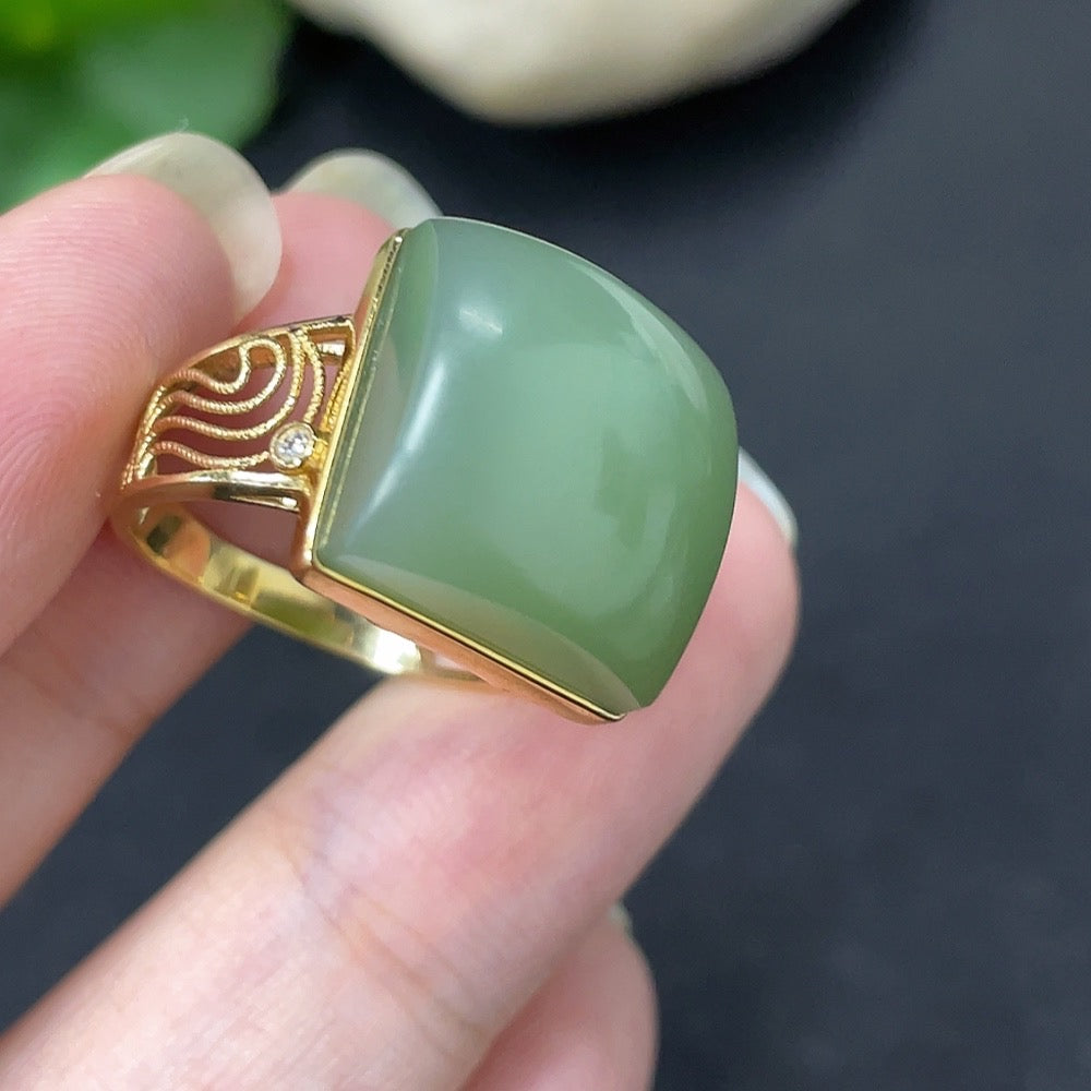 Hetian Jade inlaid ring with diamond accents in 18K gold, elegant jewelry piece featuring intricate design and craftsmanship.
