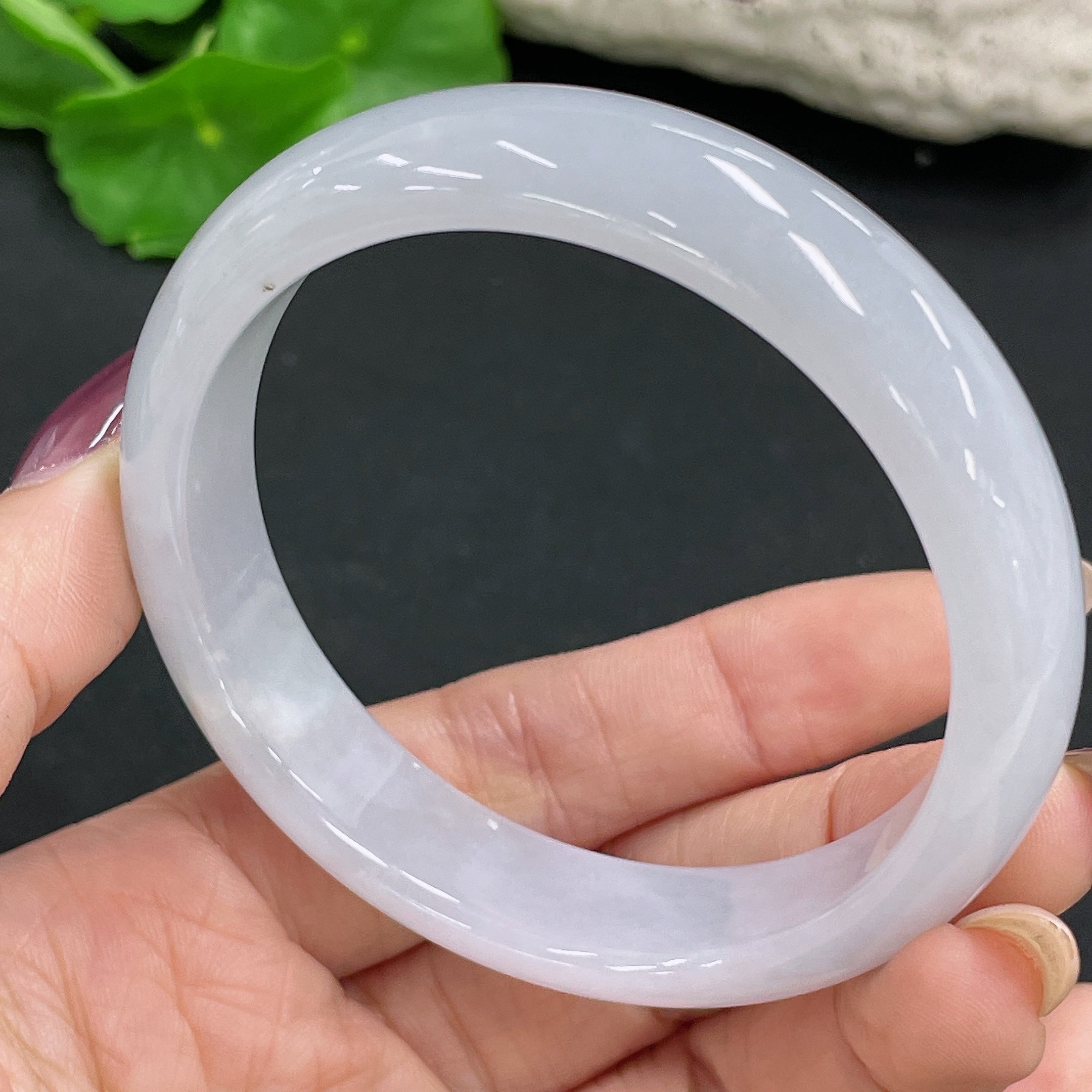 Huiliu Certified Jadeite round bangle showcasing smooth, polished jade surface with natural green hue and elegant circular shape.
