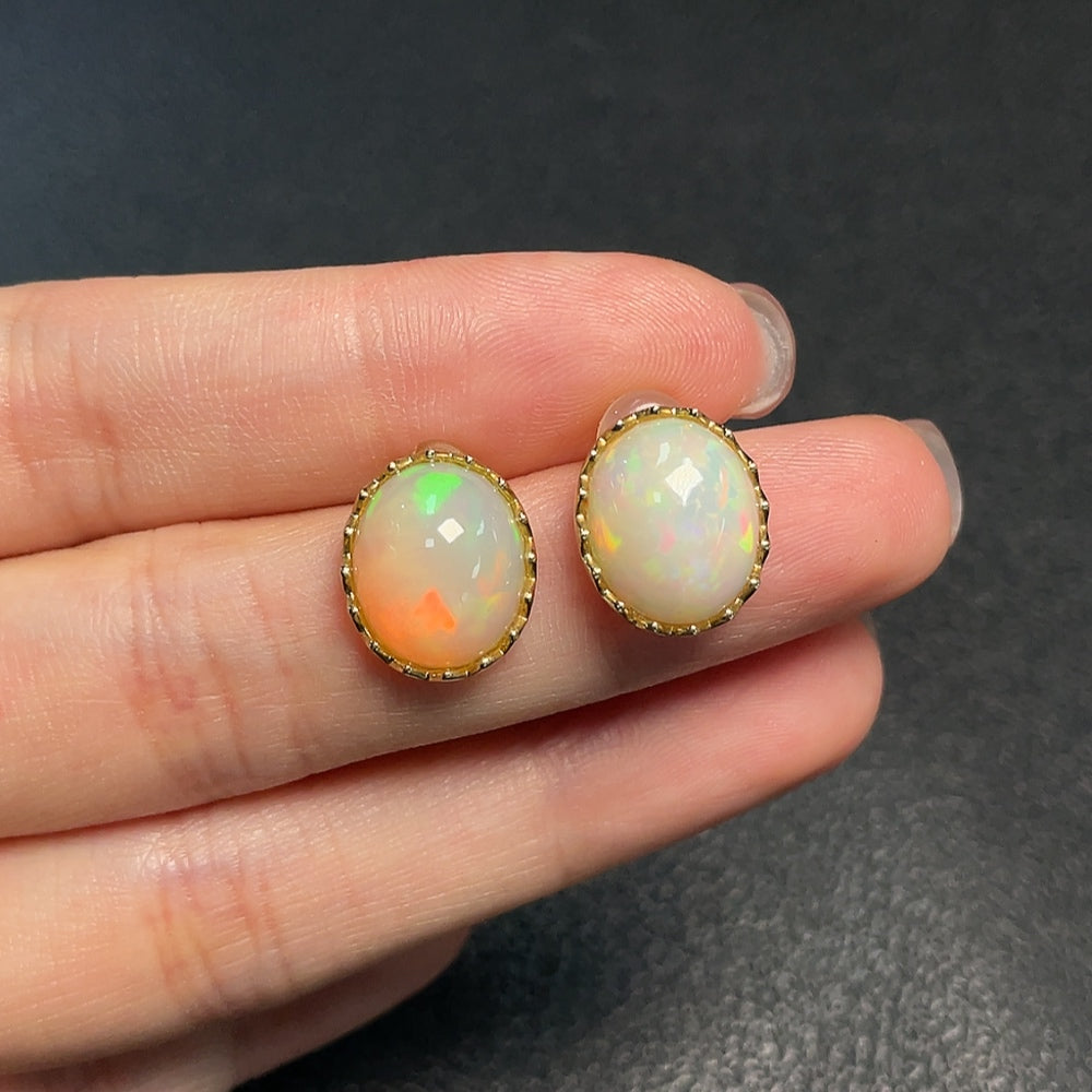 Huiliu certified opal gemstone earrings with 37% content, featuring vibrant, iridescent colors and elegant earring design.
